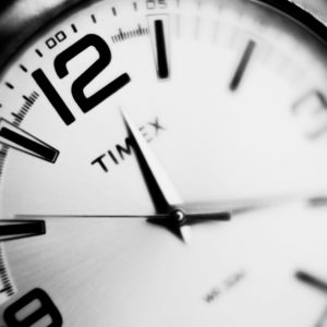 a black and white photo of a clock
