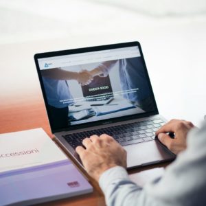 man's hands on MacBook Pro